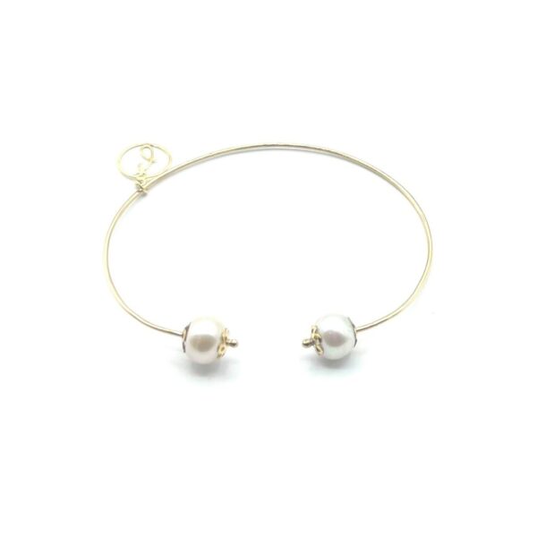 Bracelet ajustable en or 18 ct avec perles et motifs floraux, Collection First Sight, fusion parfaite de tradition et d'innovation.